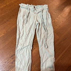 Green paperbag pants with tapered leg.